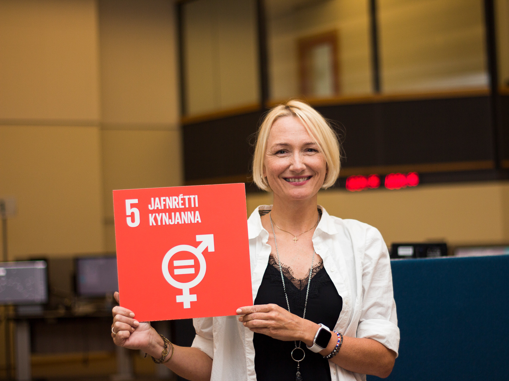 An employee holding a sign for equal rights