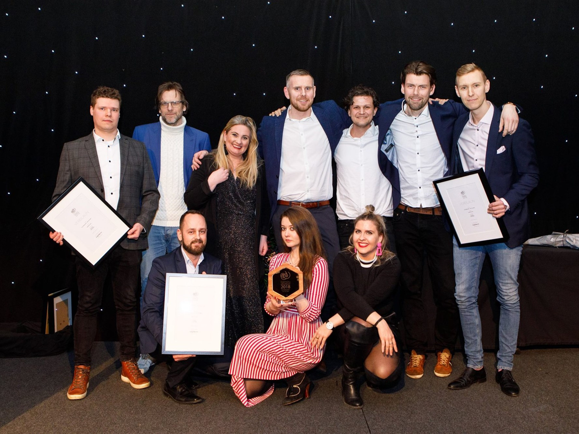 The winners pose for a photo